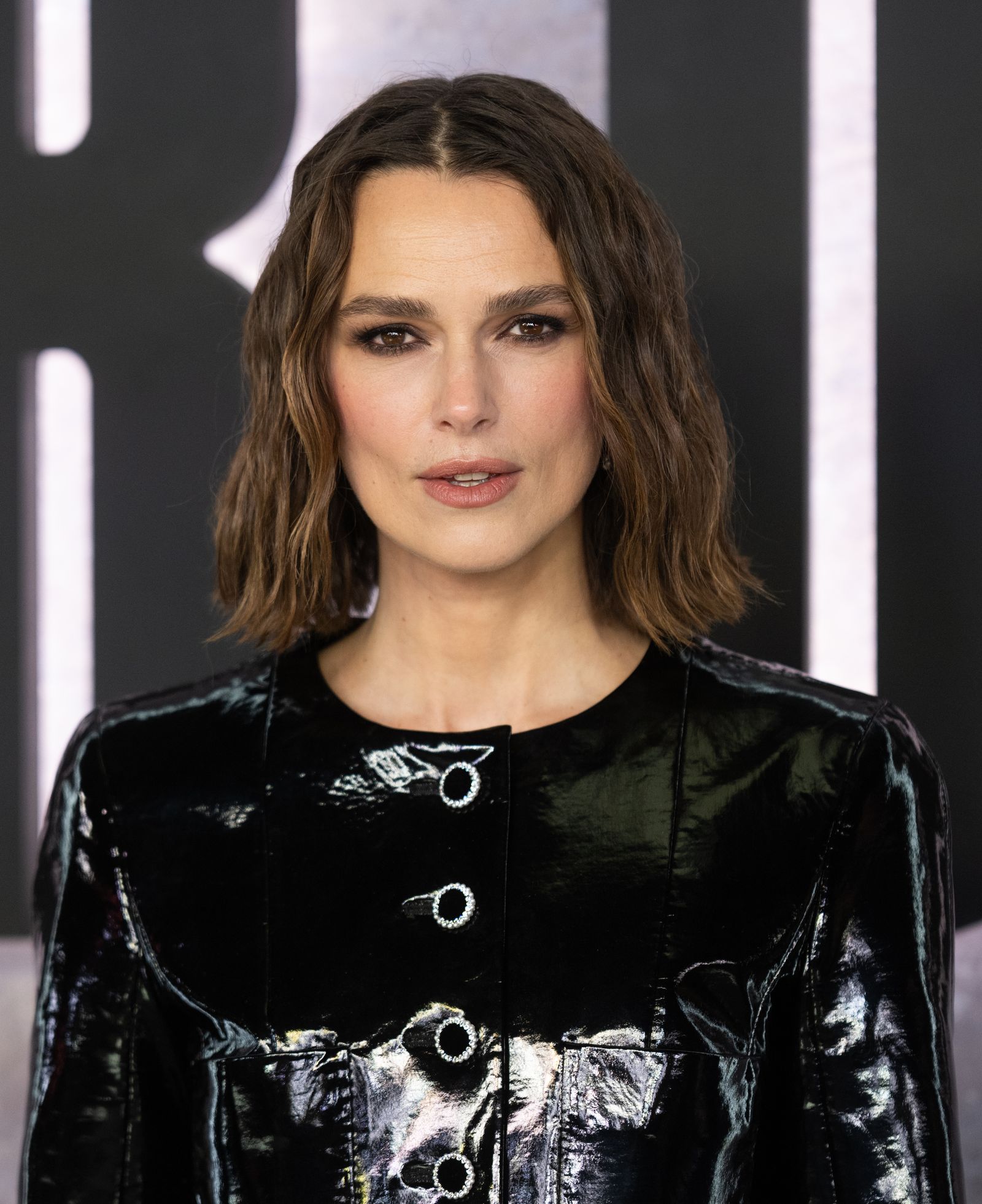 Images may contain Keira Knightley clothing, coats, jackets, adult faces, head photography and portraits