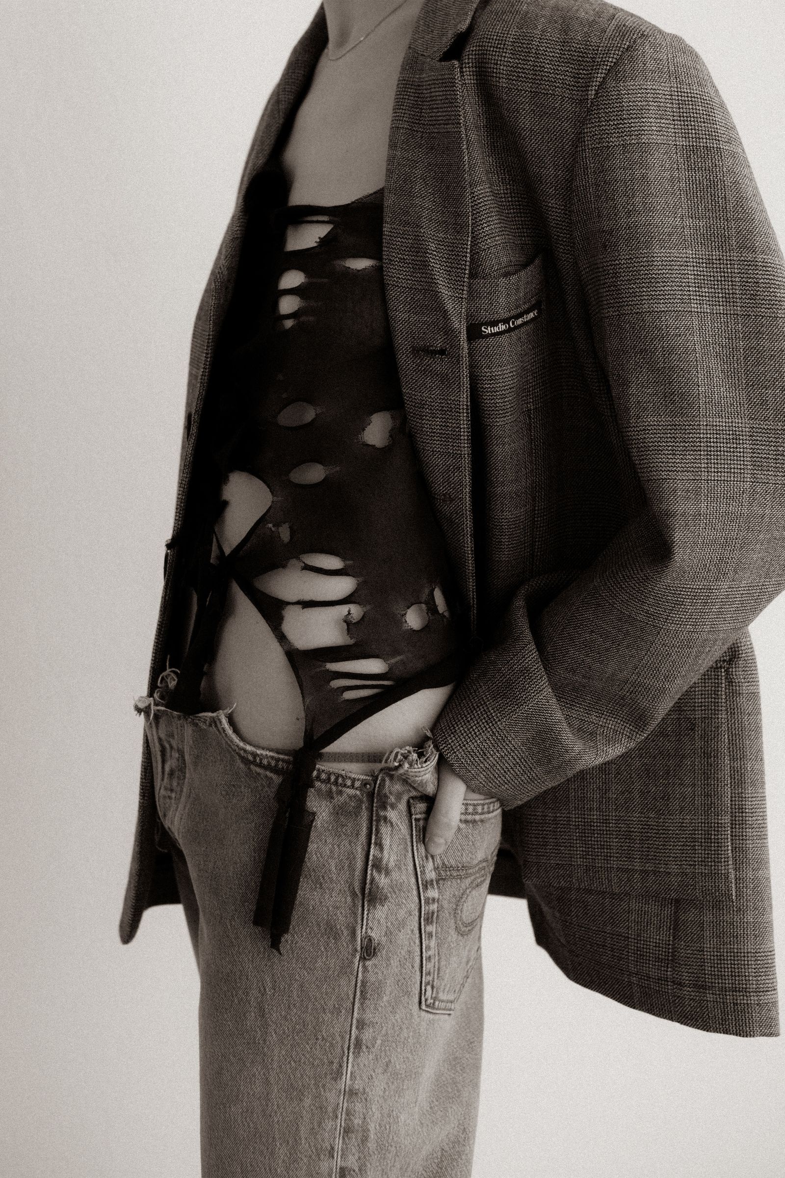 Image may contain clothing: coat, jacket, blazer, pants, long sleeves, sleeves and jeans