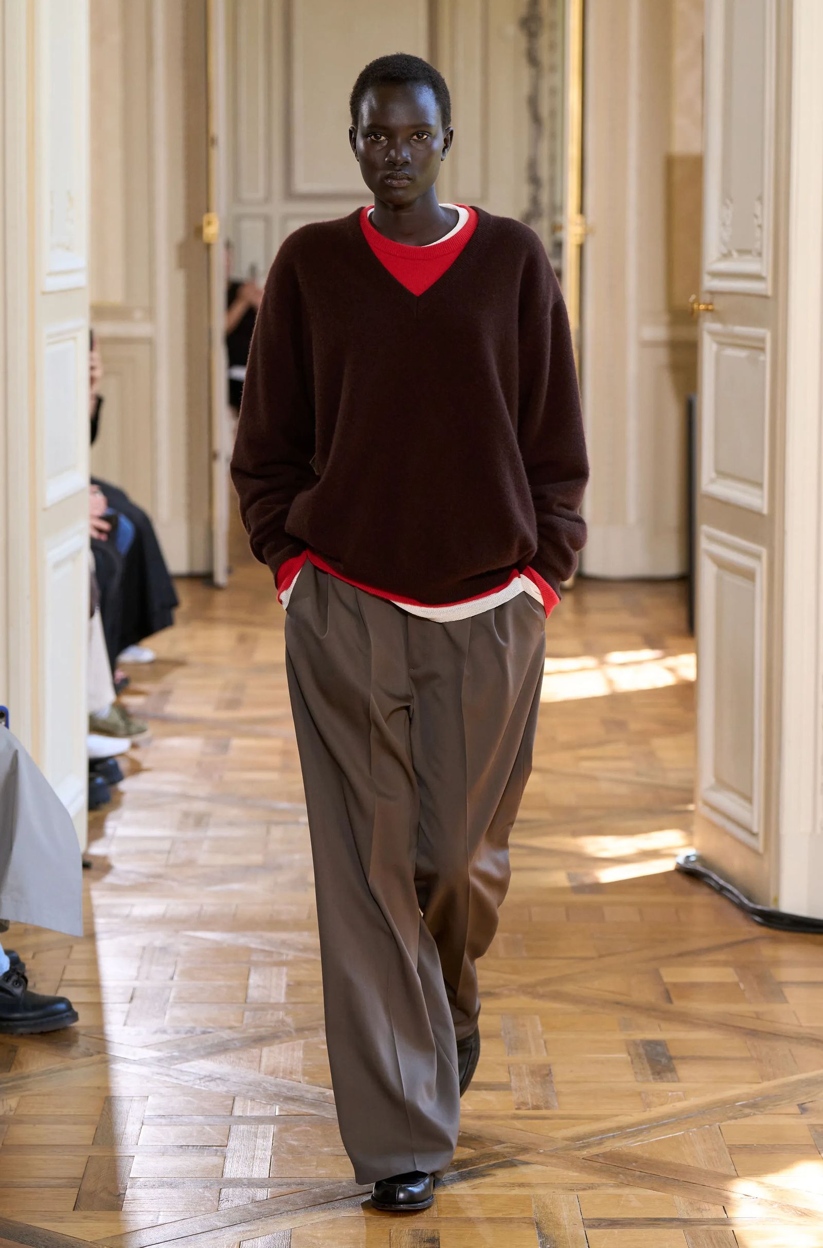 Image may contain standing adult faces and heads