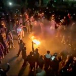 In this footage captured from a video circulating on social media, protesters dance and cheer around a bonfire and take to the streets in Tehran, Iran, on Friday, January 9, 2026, despite the Islamic Republic's growing ties with the rest of the world. (UGC, AP)