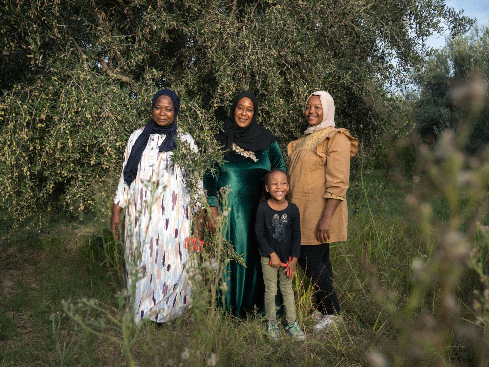 Image may contain faces and heads of adults, families, children