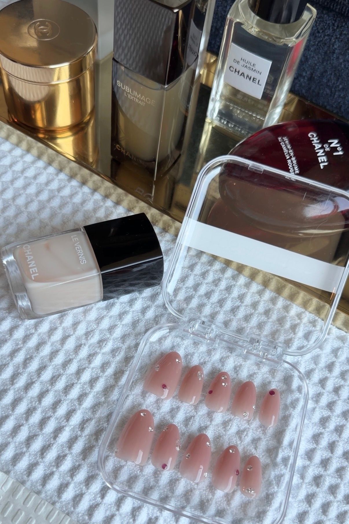 Image may contain cosmetic bottles and perfume