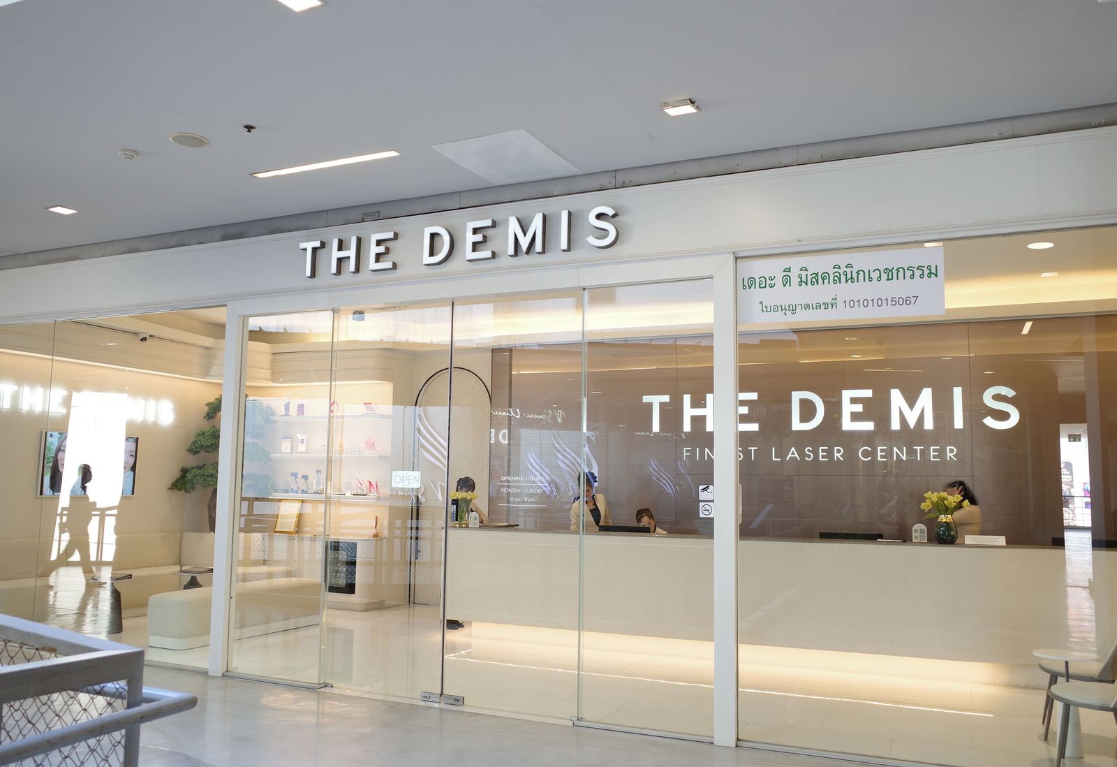 Image may contain people, lights, airport and shops