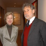 A woman and a man look into the camera.