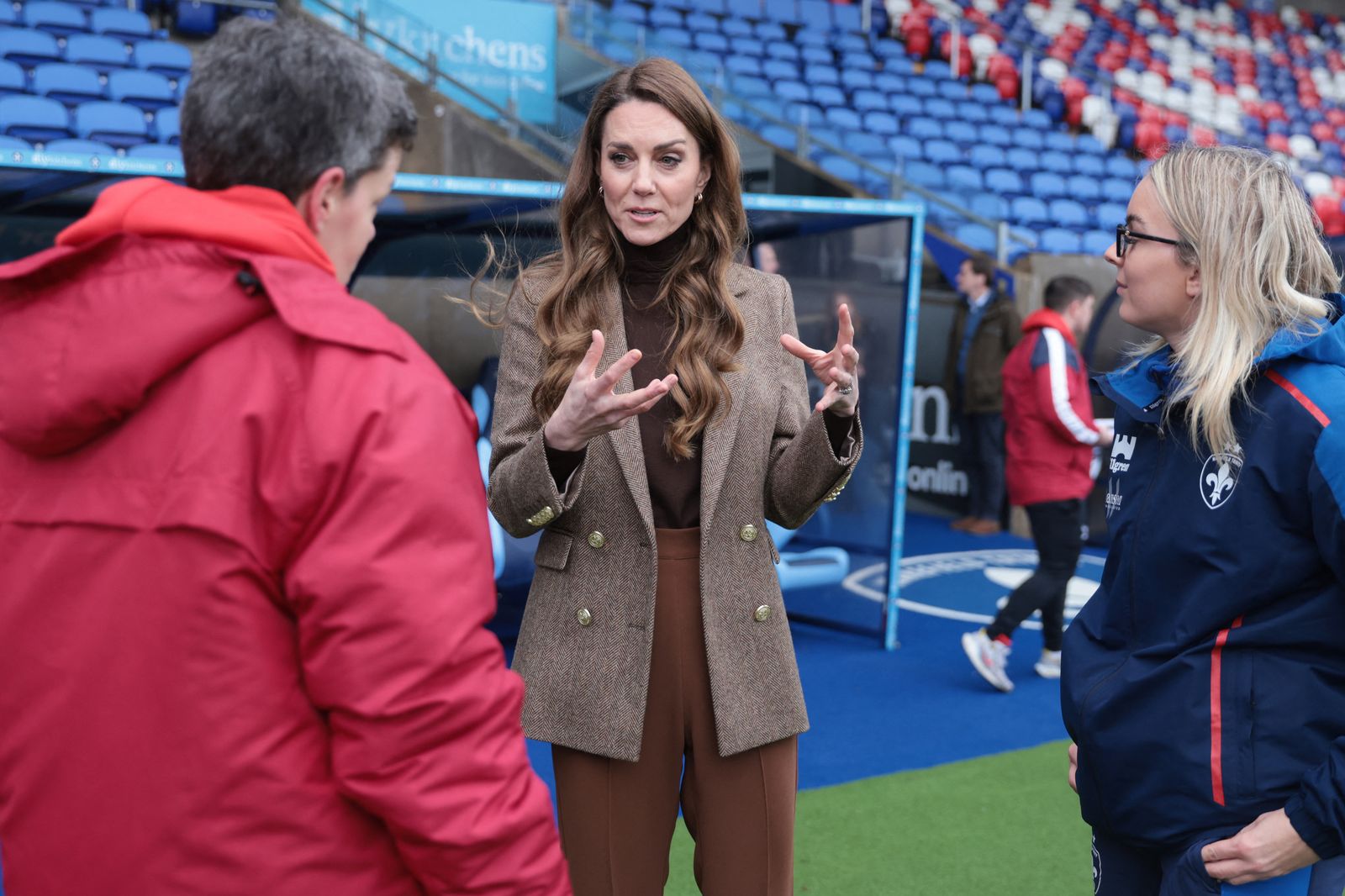 Image may contain clothing, coats, adults and people