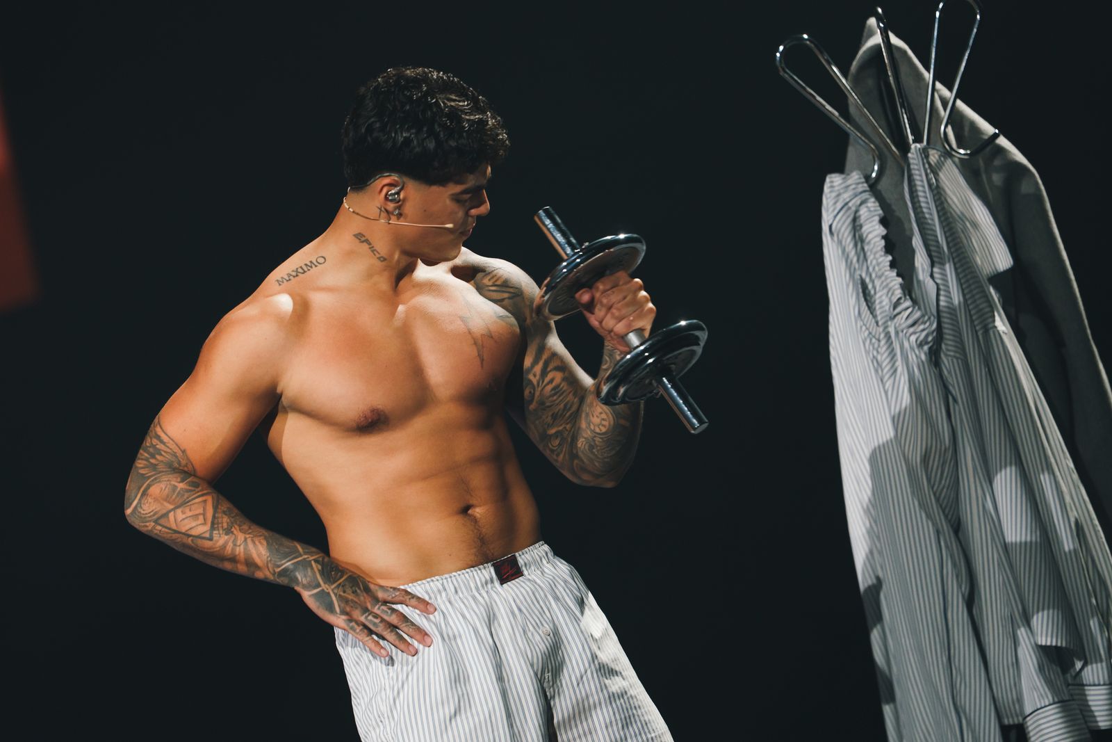 Image may contain people skin tattoos adult face head biceps curly hair fitness gym gym weights sports and workouts