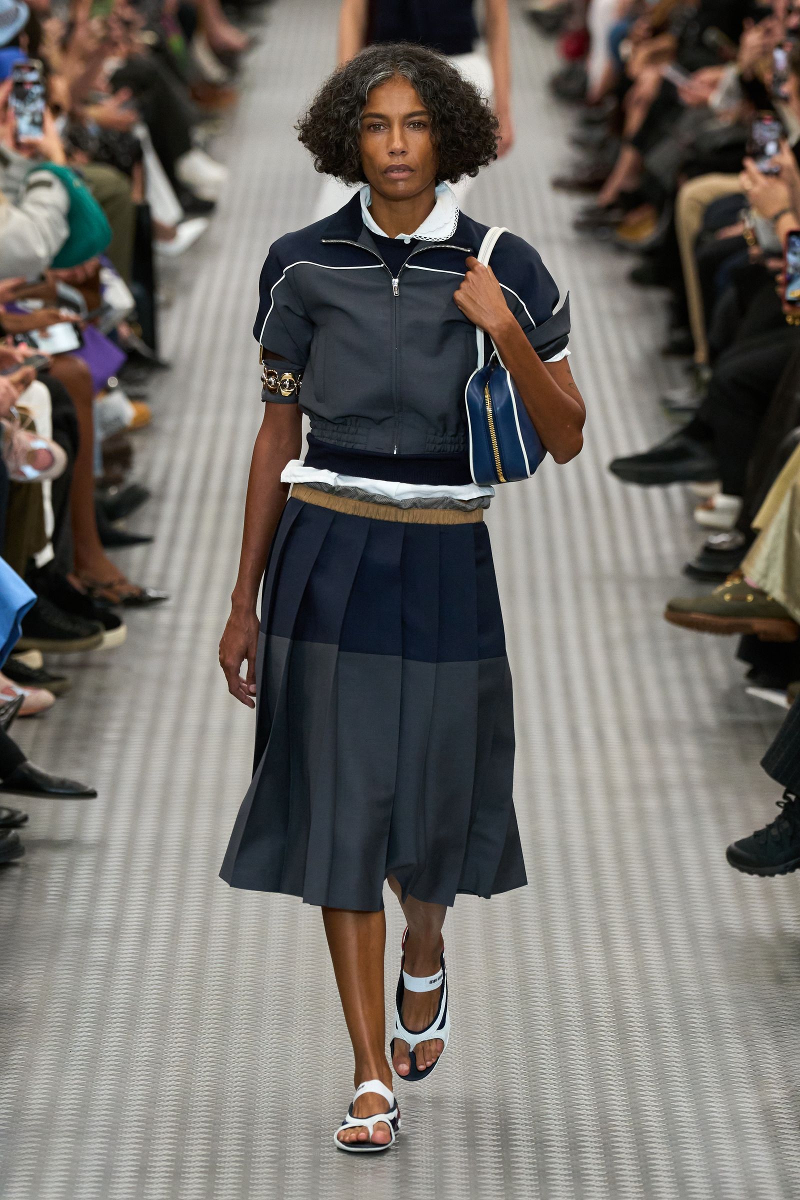 People may be pictured in: youth clothing, footwear, sandals, accessories, bags, handbags, shoes, adult skirts and electronics