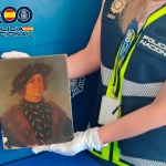 A Spanish police officer showed off a fake painting purportedly by Leonardo da Vinci.