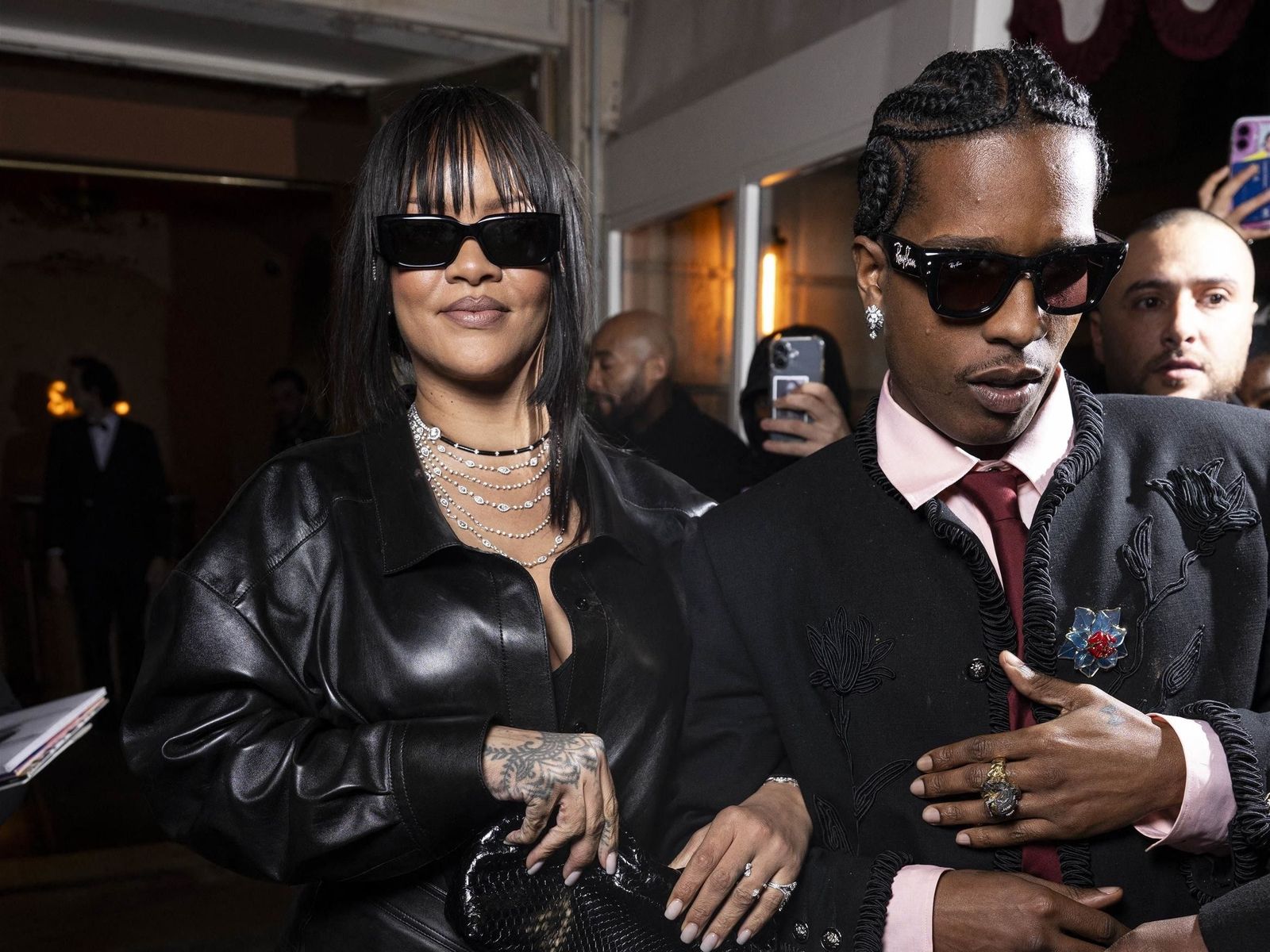 Image may contain Rihanna Dennis Scott clothing, coats, jackets, electronics, mobile phones, adults and people