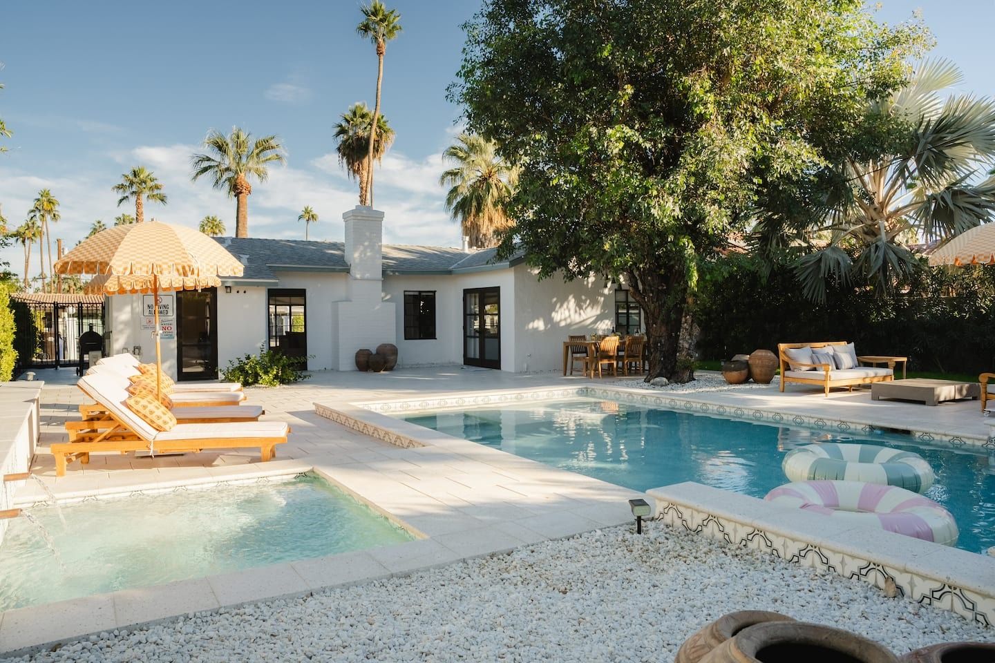 Image may contain building, building, house, villa, pool, water, swimming pool, outdoor and clothing