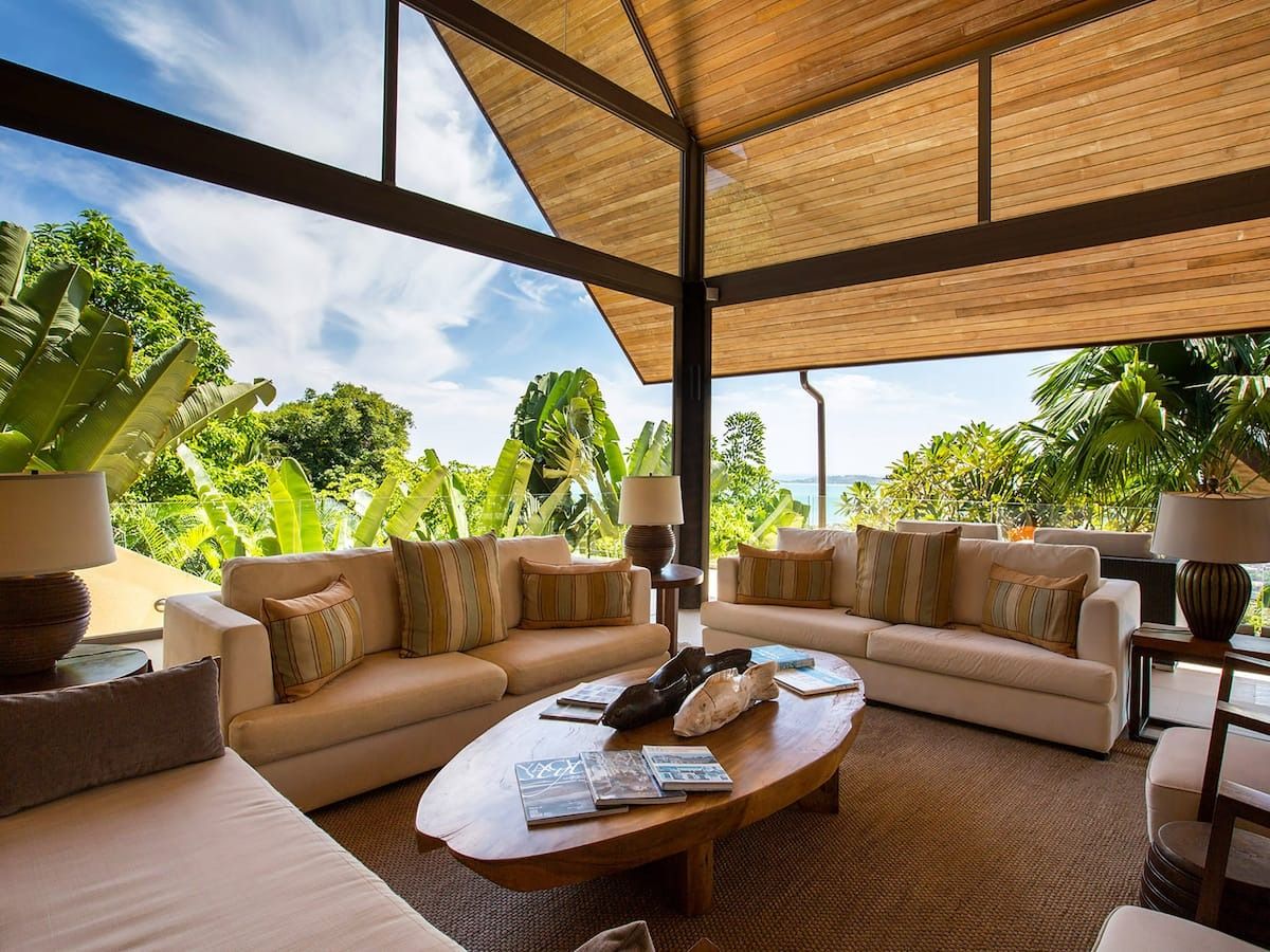 Image may contain books, publications, furniture, tables, interiors, coffee tables, lamps, sofas and architecture