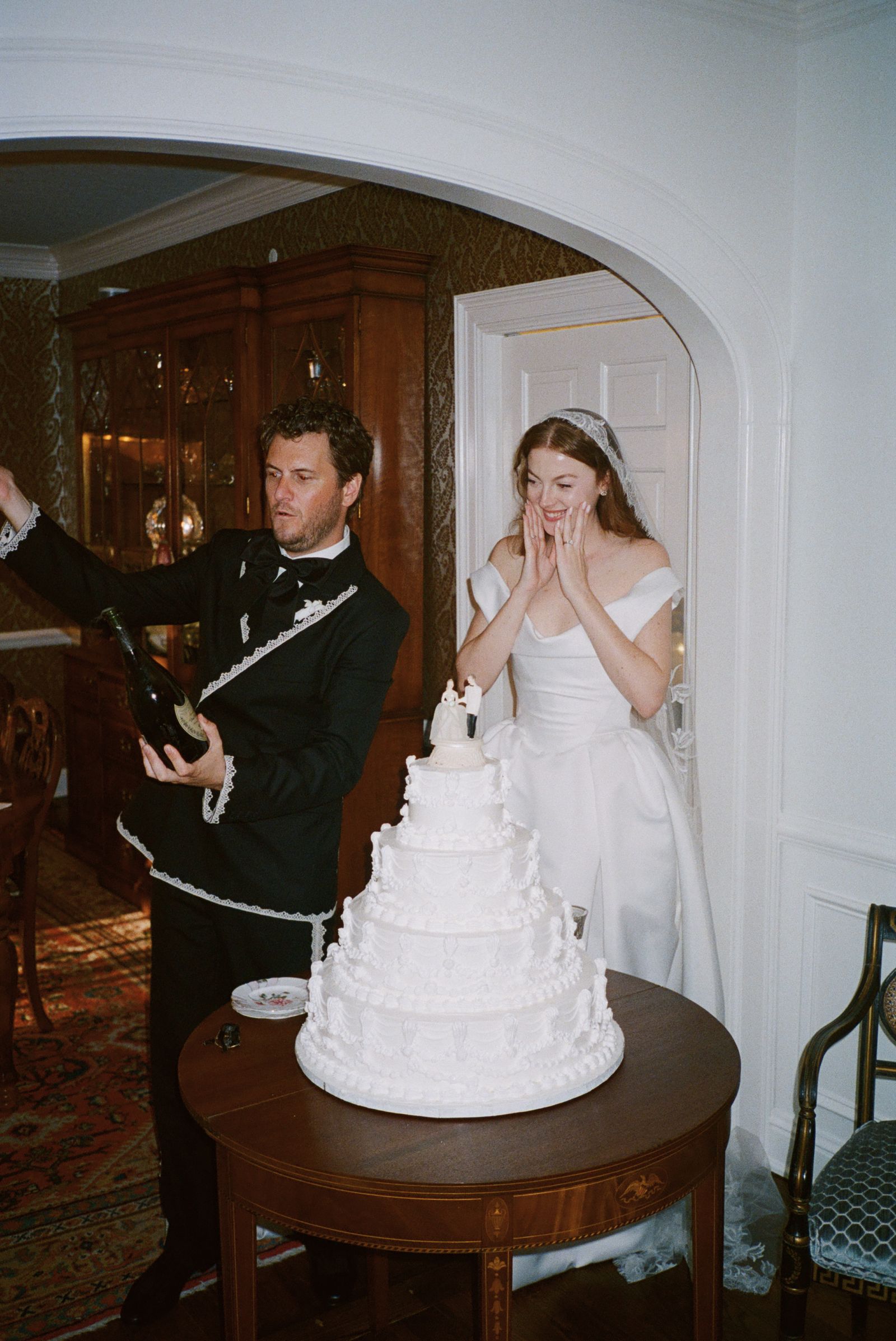 Images may contain faces, heads, people photography, portraits, clothing, formal wear, suits, dresses, cream, desserts and food