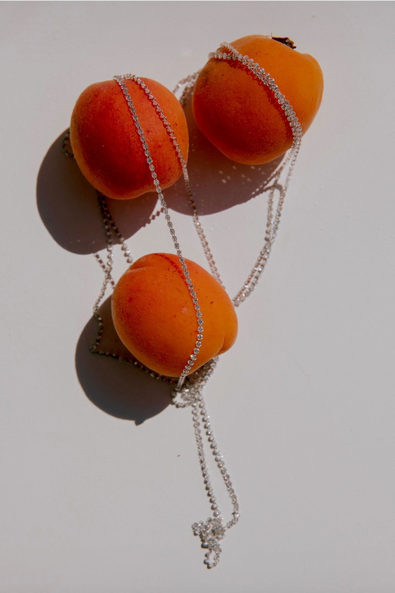 Image may contain food, fruit, plant, produce, apricot ball, cricket, cricket and sports