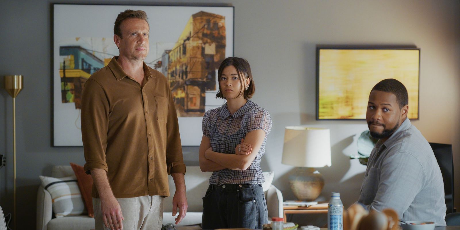 Image may contain clothes sleeves shirt table lamp adult face happy head smiling pants and jacket