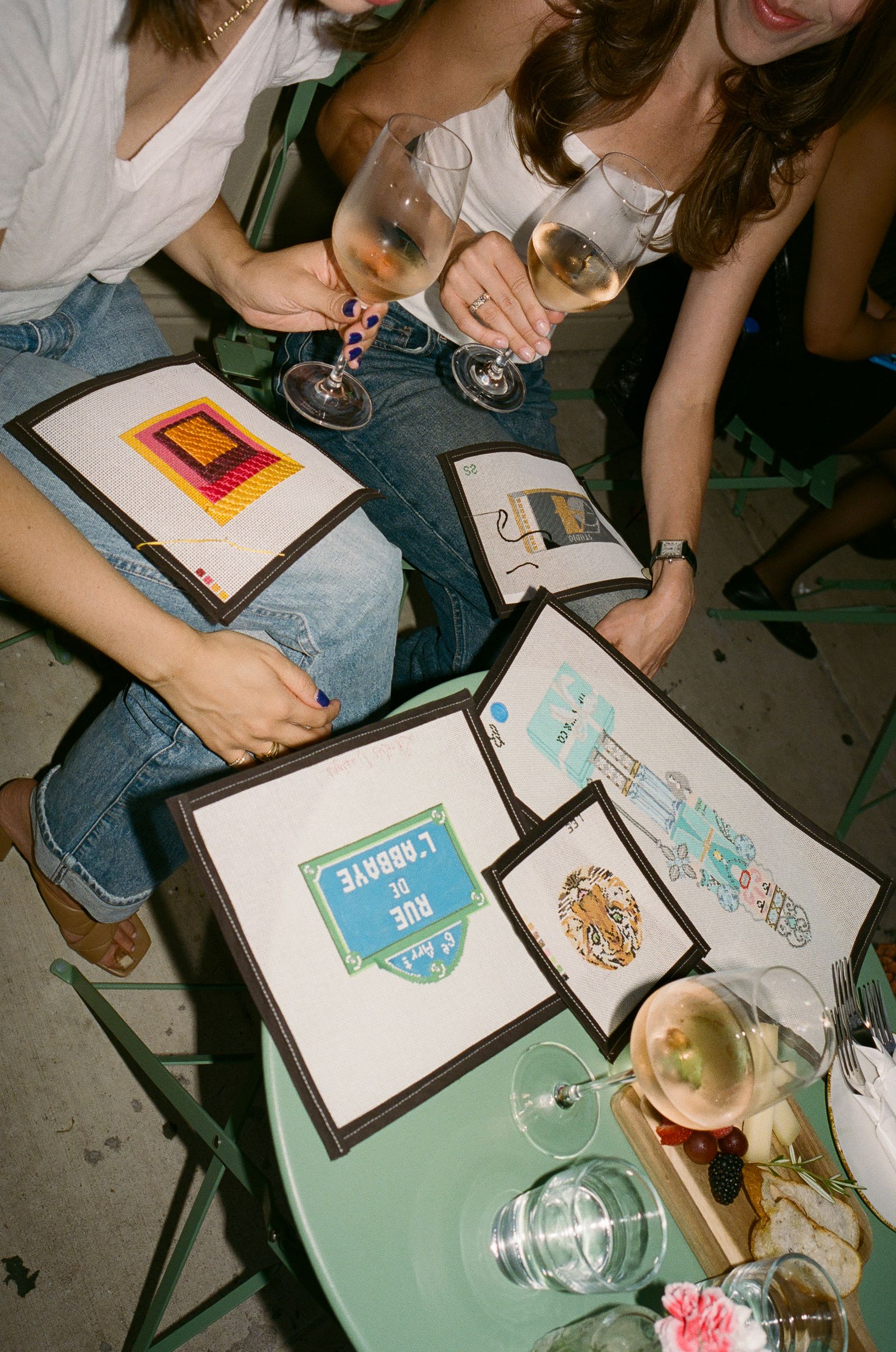 Image may contain furniture, table, people, dining table, watch, clothing, footwear, shoes, pants, adult and tabletop