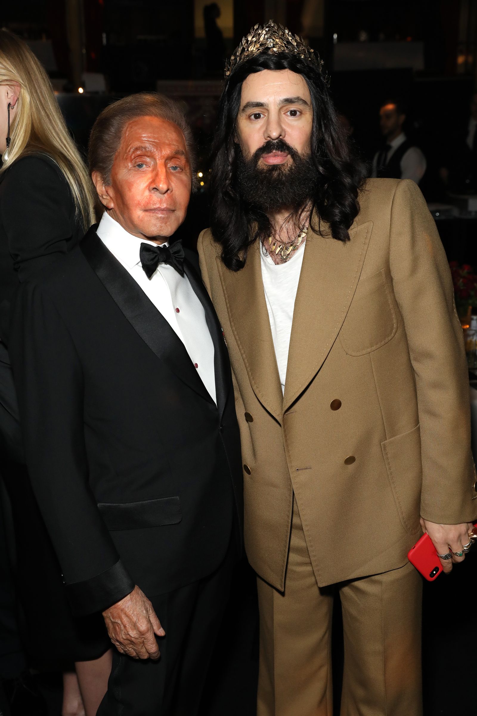 Image may contain Alessandro Michele ClothingCoat Jacket Person Blazer Photobombing Adult Formal Wear and Suit