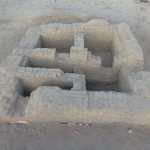 The dusty brick remains of a building