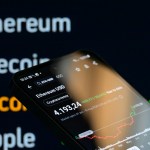 Smartphone in front of screen.