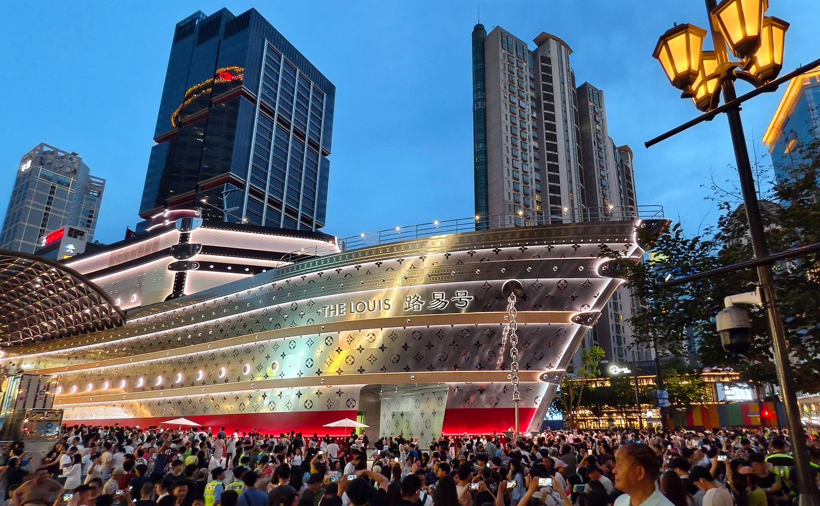 Image may contain city architecture, architecture, cityscape, concert crowd, people, clothing, hats and people