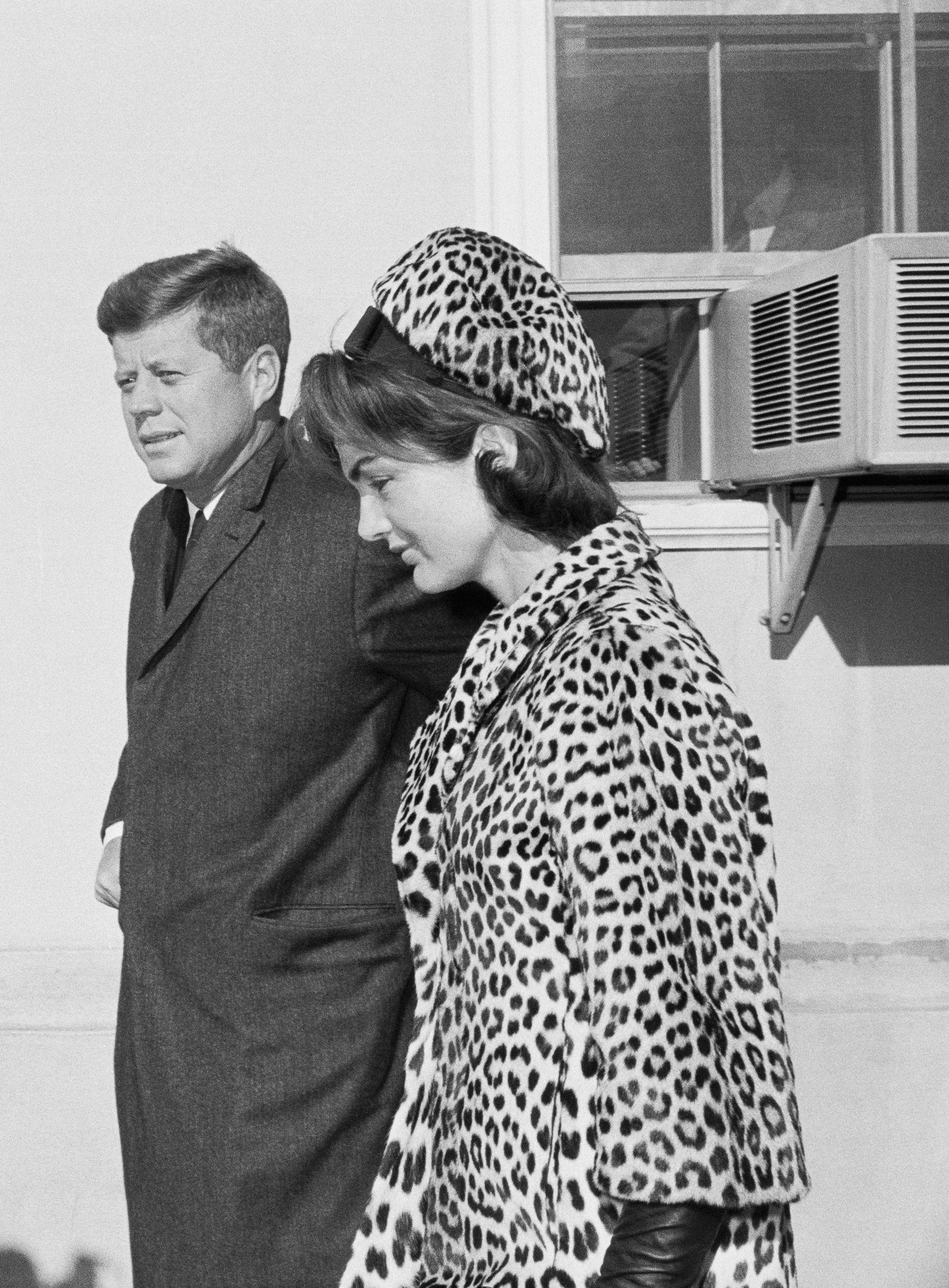 Middleburg, Virginia Photo of President and Mrs. Kennedy emerging from the Middleburg Community Center where they attended...
