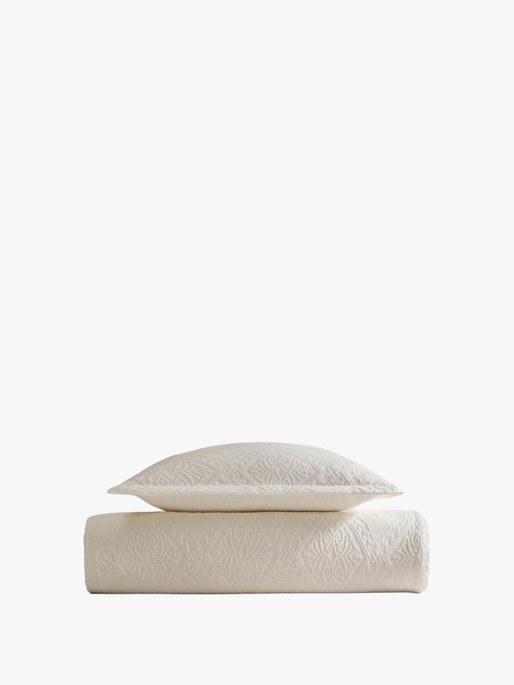 Image may contain: cushions, home decor, pillows and linen