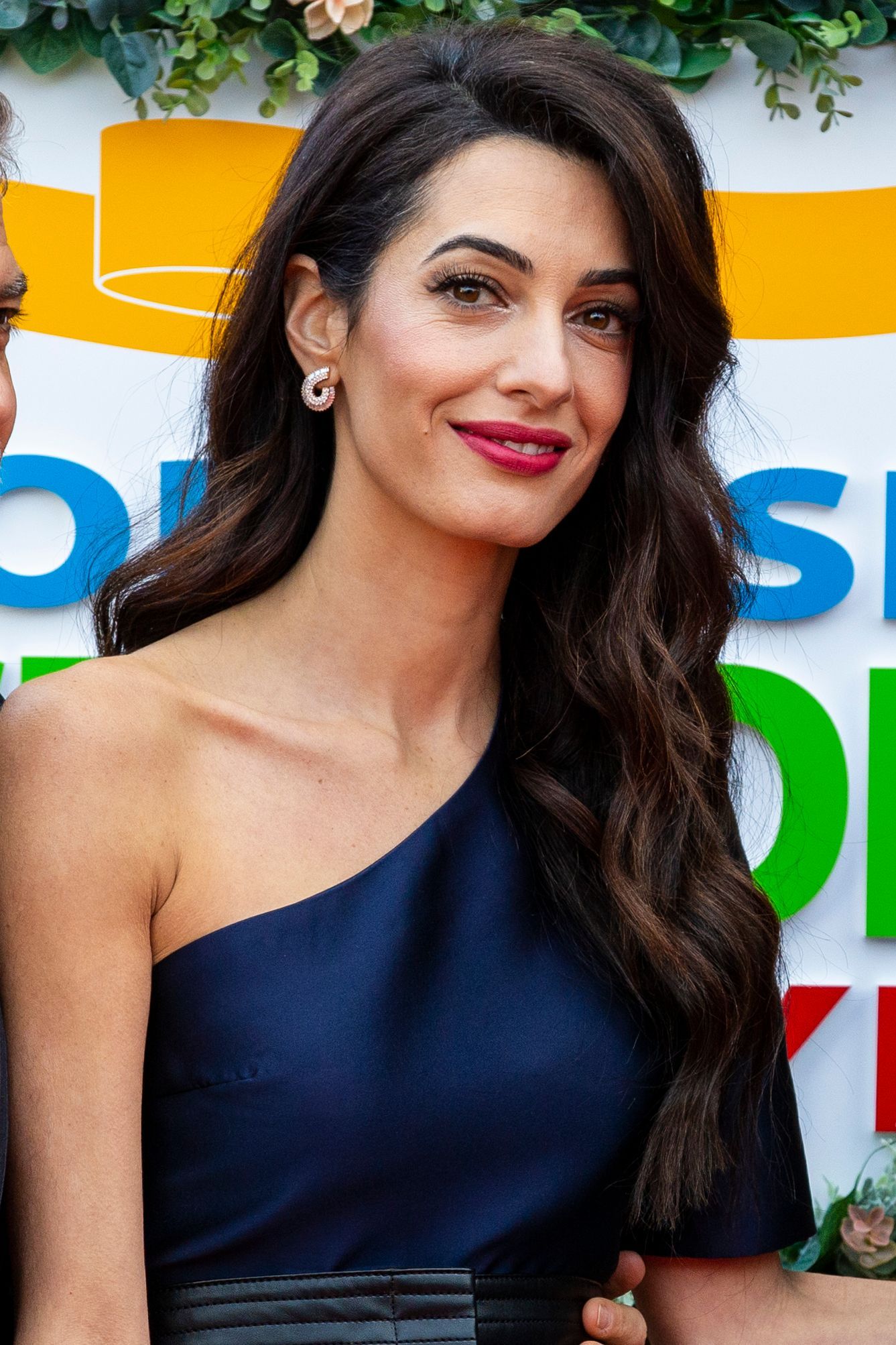 Image may contain human faces and Amal Clooney
