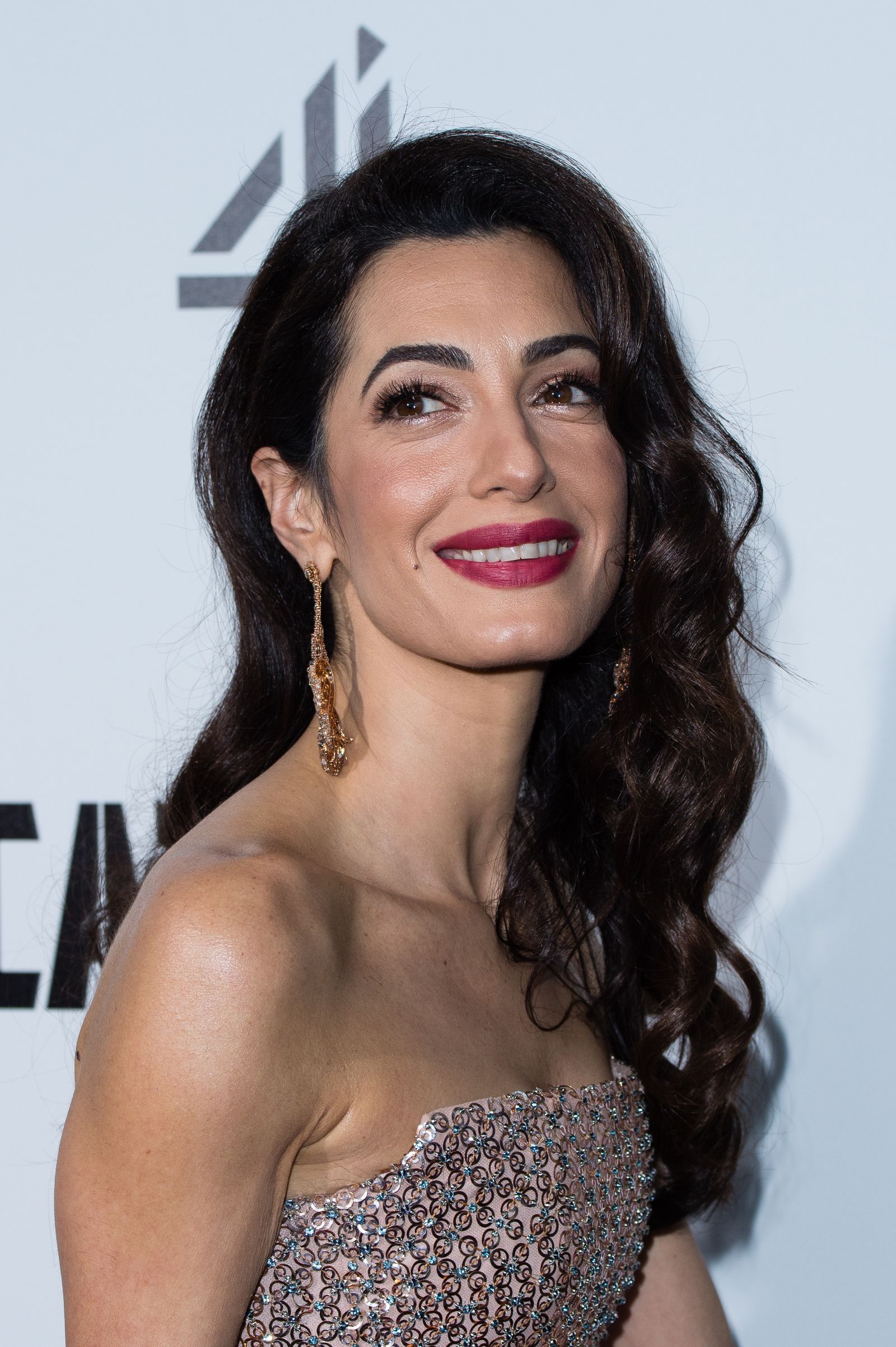 Image may contain people Amal Clooney Face Fashion Outfit