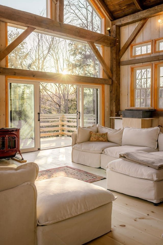 Image may contain home decor, rug, sofa, furniture, interior interior design, door, lamp, chair, building and architecture