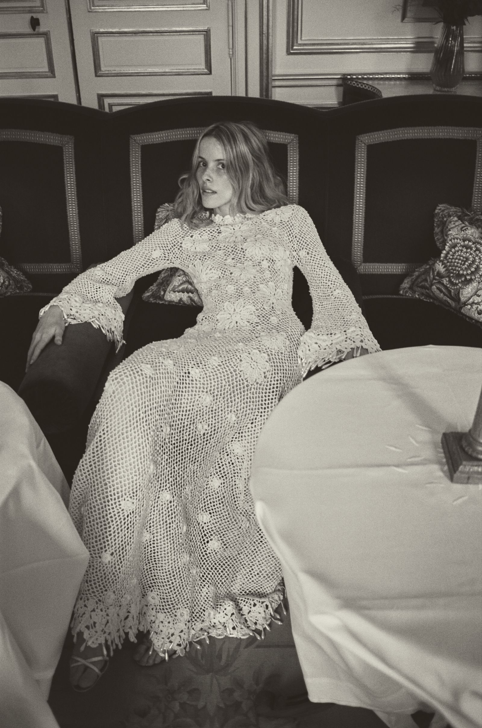 Image may contain clothing, dresses, adults, wedding formal wear, fashion gowns, wedding gowns, furniture and faces