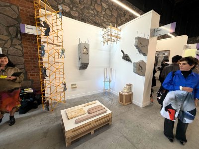 A man stares at a scaffolded stall.
