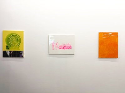 Three paintings of cars and car wheels.