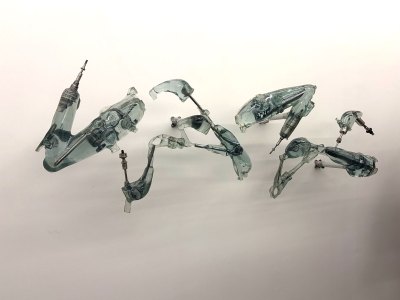 Several prosthetics are mounted on the walls.