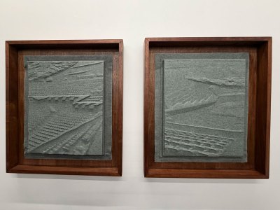 Two framed pieces of felt were moved to showcase the concert hall.