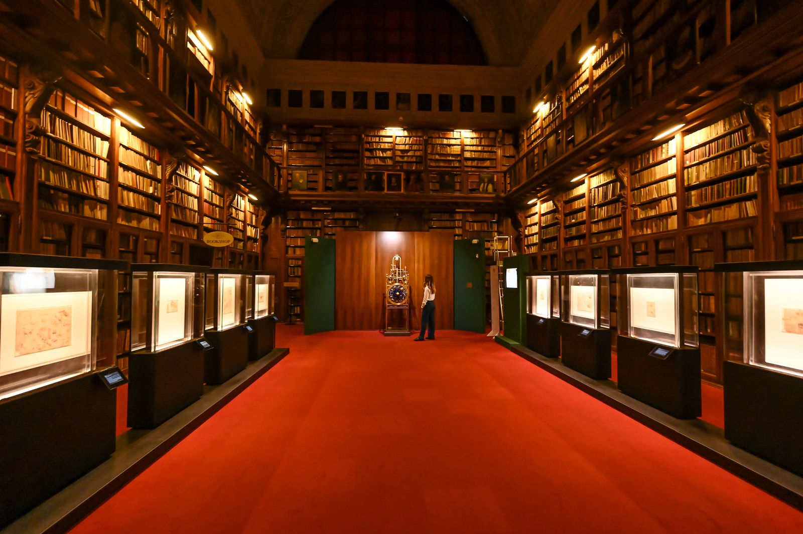 Image may contain Book Indoors Library Publication Architecture Building Fashion and Person