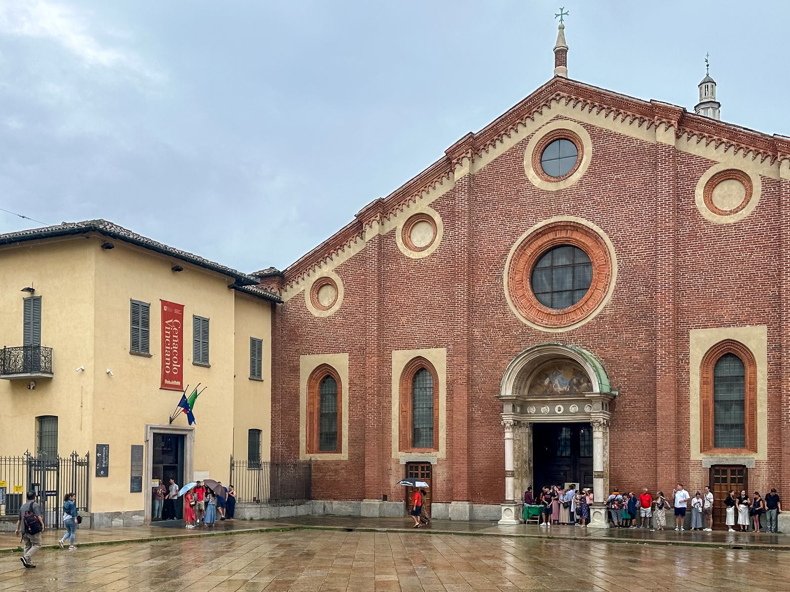 Image may contain Arch Architecture Gothic Arch and Person