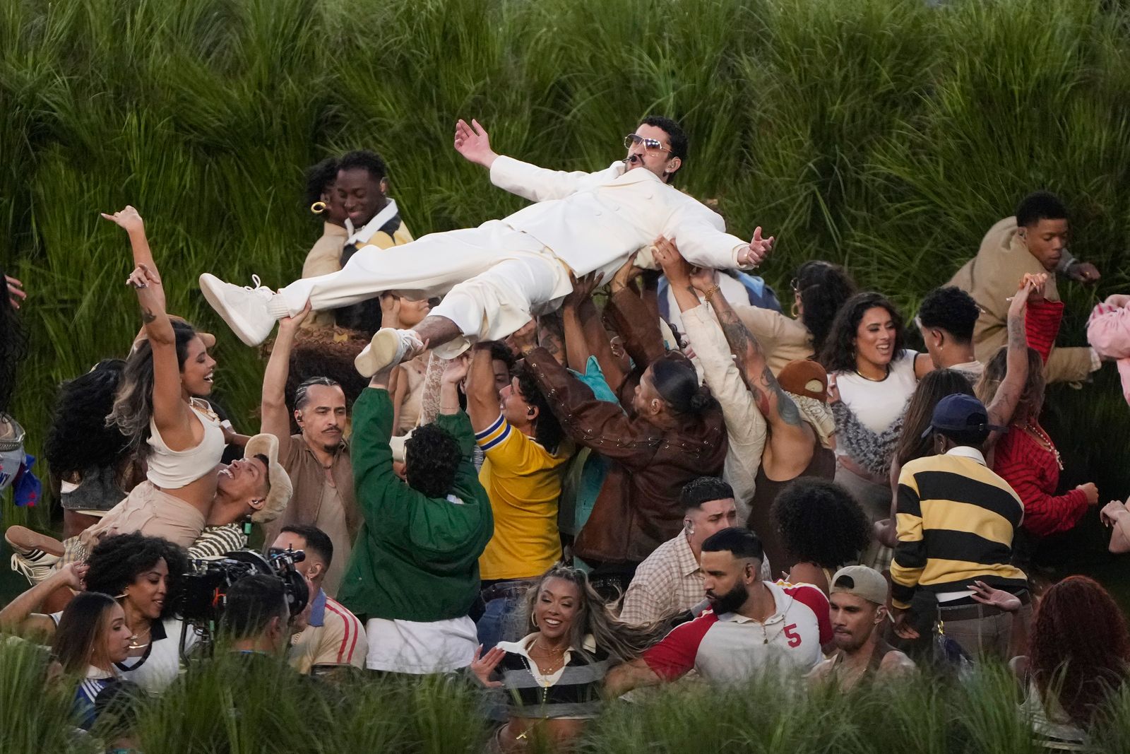 Image may contain Drake Ray Sepúlveda Bad Bunny Mitsutoshi Shimabukuro face, character accessories and glasses