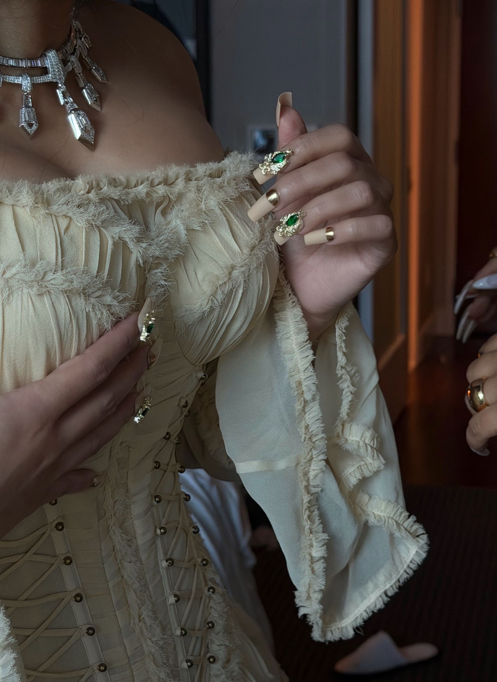 Image may contain body parts, fingers, hands, people, clothing, dresses, shirts, accessories, jewelry, rings, adults and weddings