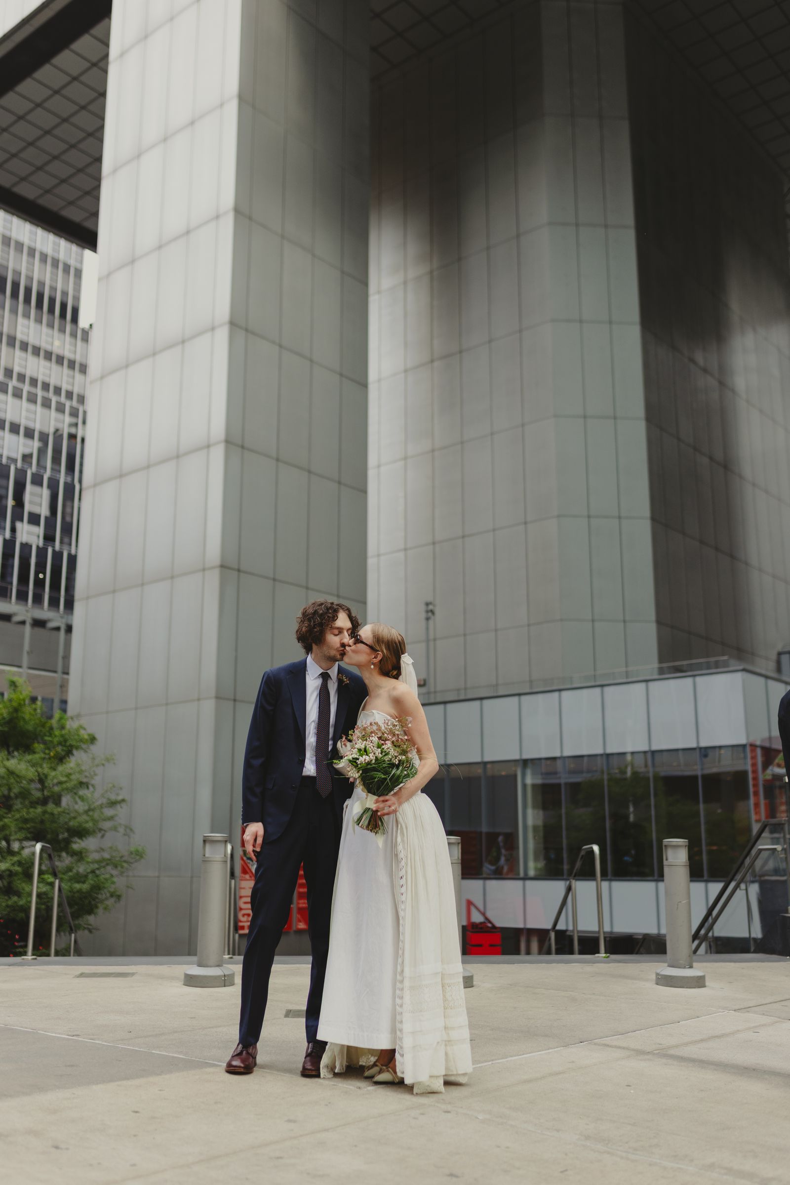 Image may contain Marko Kon Blazer clothing coat jacket formal suit adult wedding city and dress