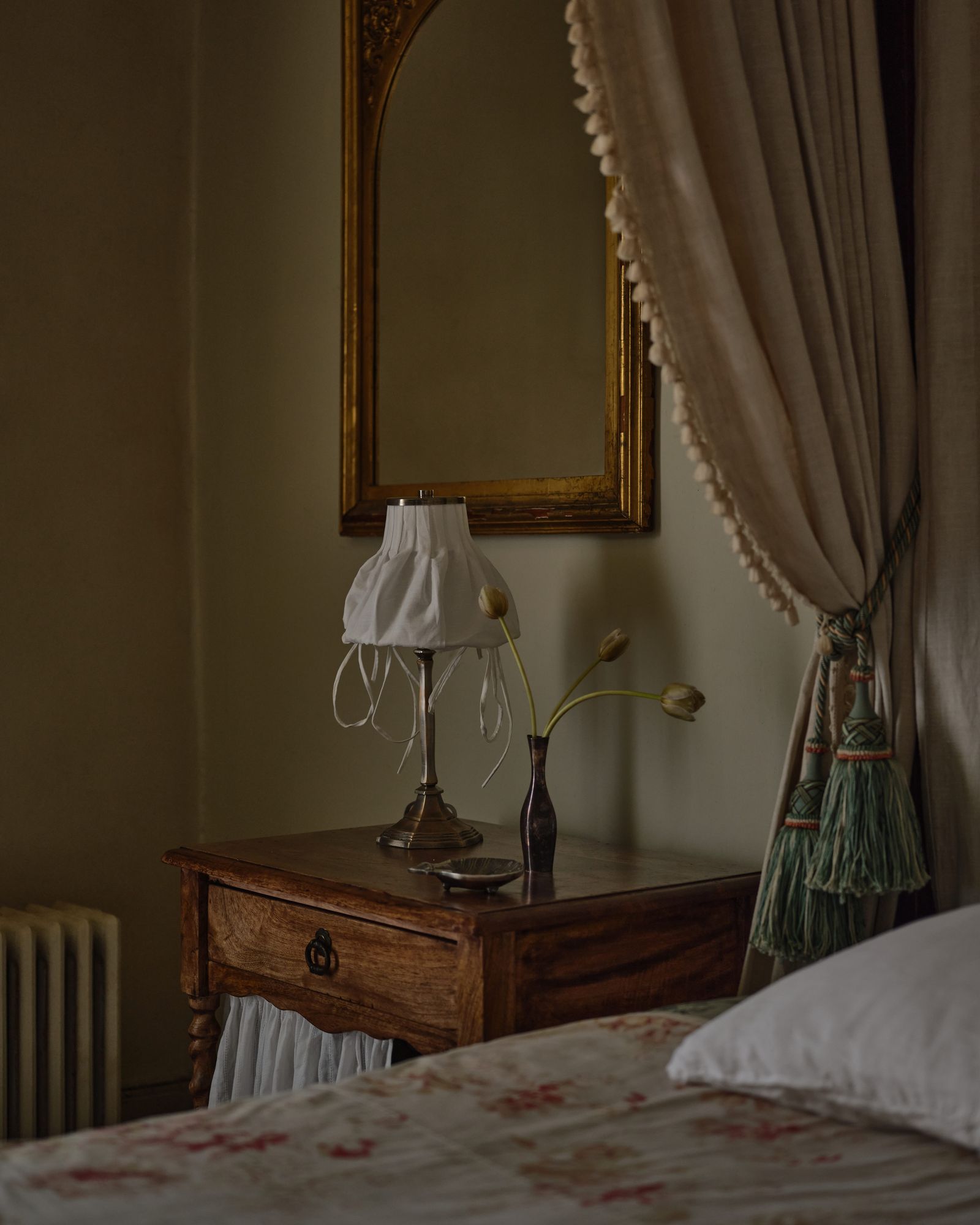 Image may contain lamps, lamps, beds, furniture and dishes