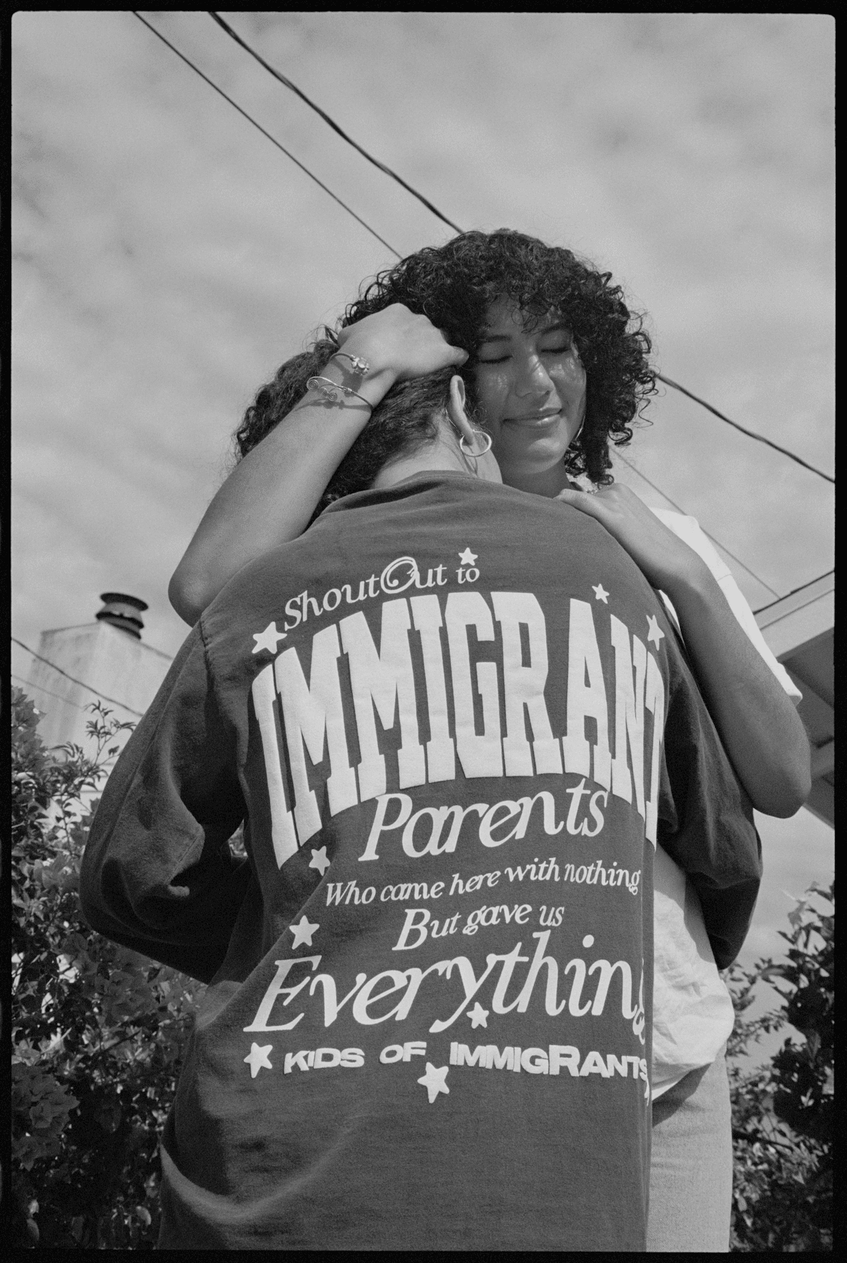 Images may contain clothing, t-shirts, people photography, body parts, fingers, hands, faces, heads and portraits