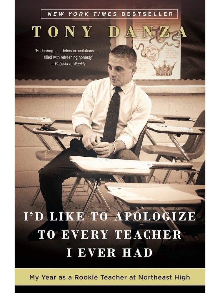 Image may contain: book, publication, advertisement, adult, people, poster, accessory, formal clothing, tie and chair