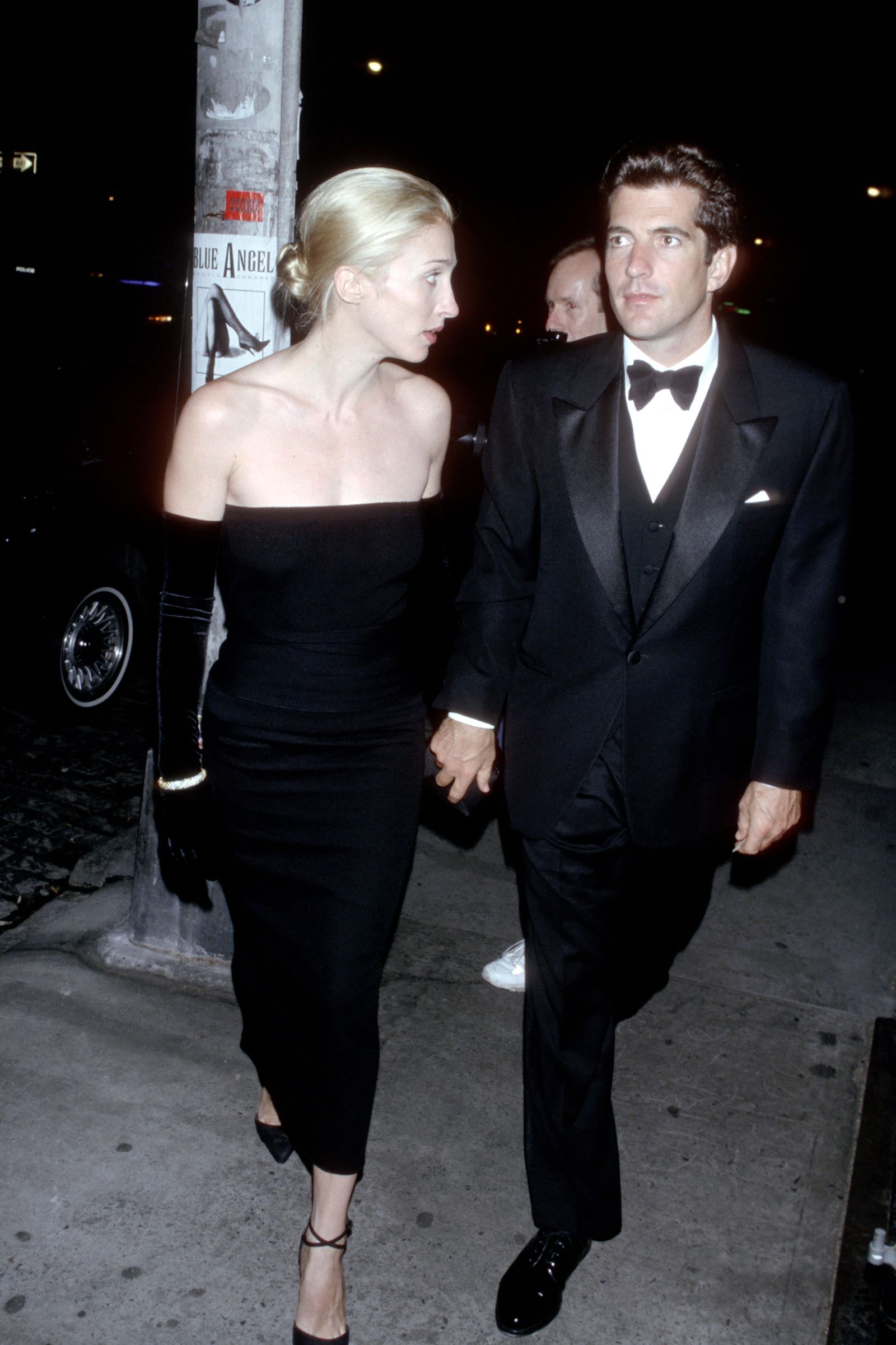 Image may contain John F. Kennedy Jr. Carolyn BessetteKennedy clothing formal suit adult city and road