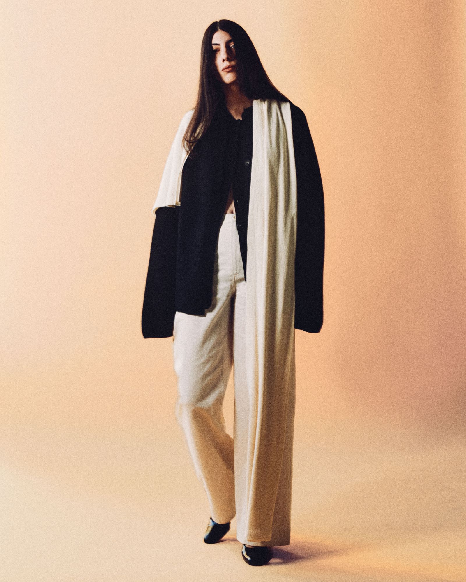 Image may contain Anne Bedian Clothing Coats Fashion Capes Formal Suits Adults and Individuals