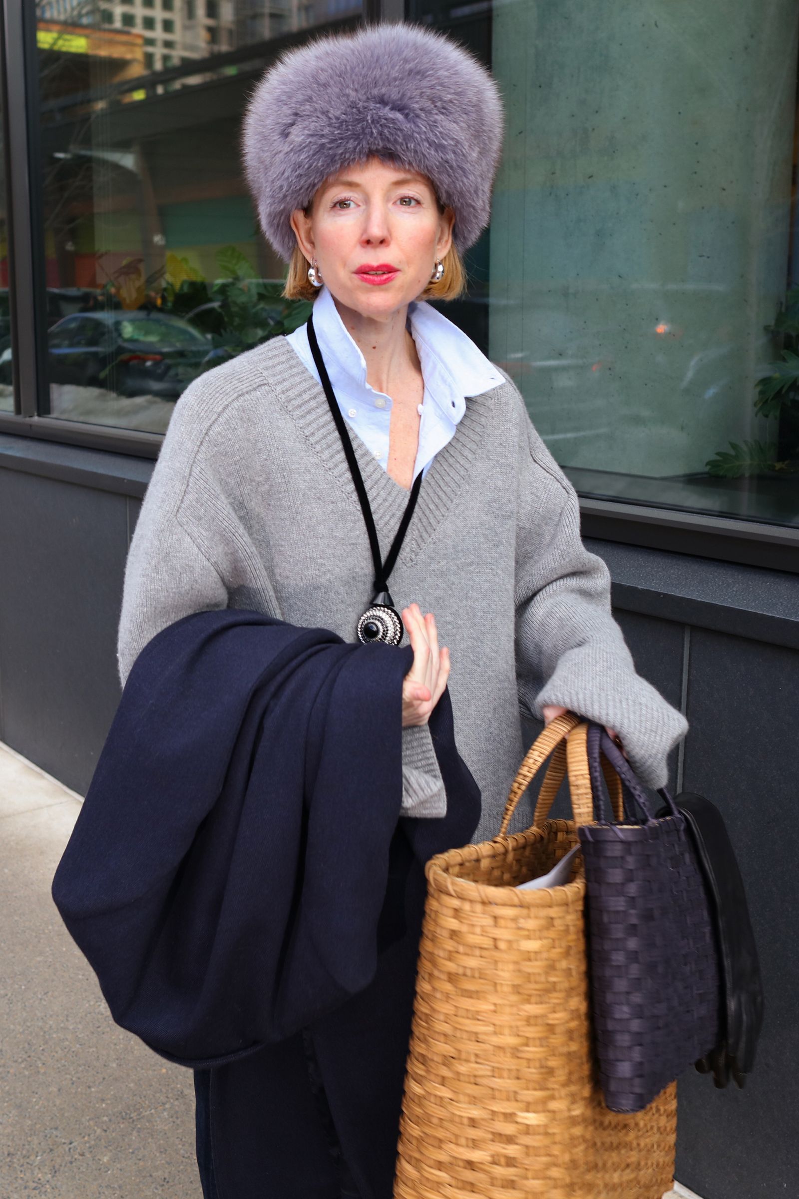 Image may contain personal accessories, bags, handbags, adult wallets, cars, transportation, clothing and hats