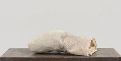 The work, made from concrete, flannel and resin, looks like a stretched condom. 