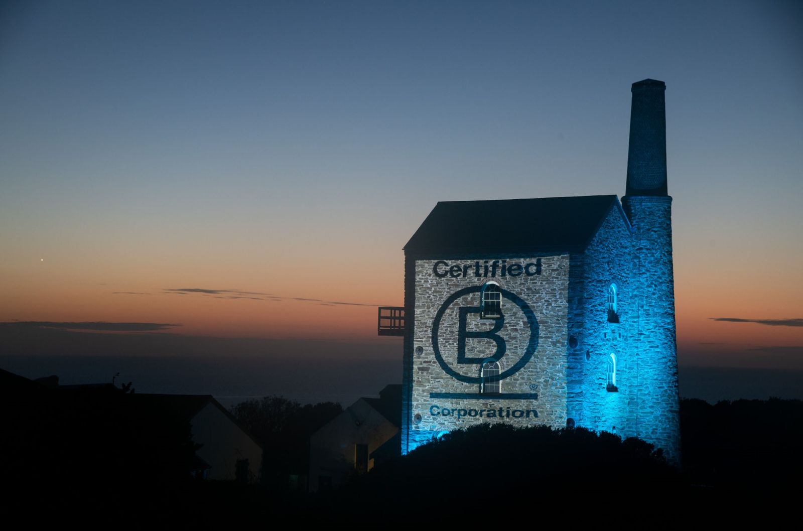 Image may contain building, architecture, outdoor, shelter, nature, sky, advertising, country cabin and countryside