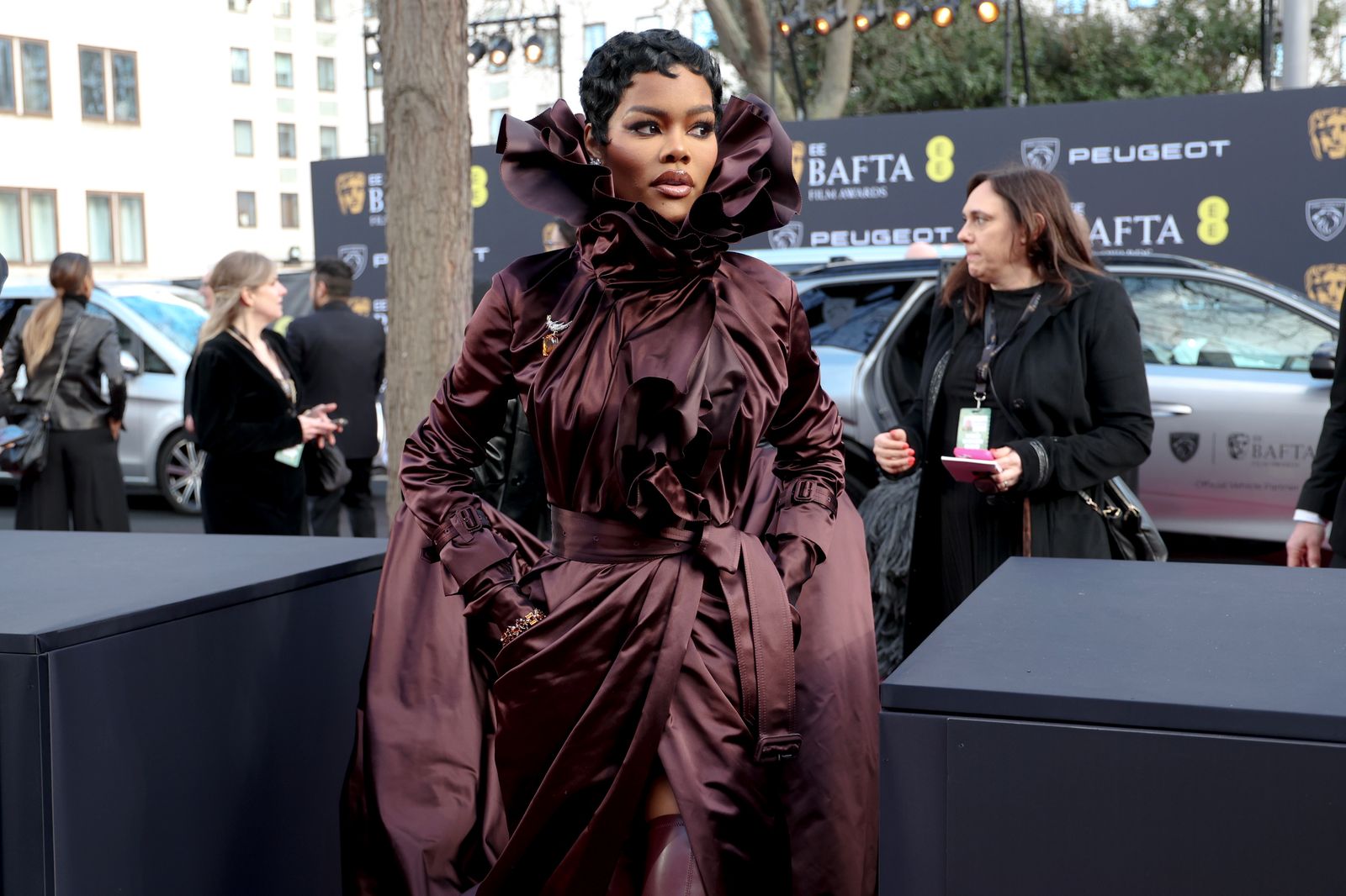 Image may contain Teyana Taylor Clothing Jacket Adult Student Fashion Head Face Black Hair and Hair