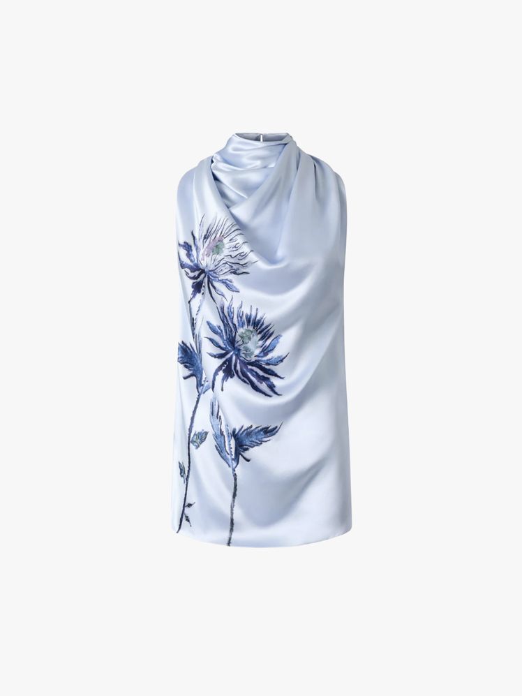 Image may contain: clothes, scarf and dress