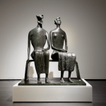 Bronze sculpture of two people.