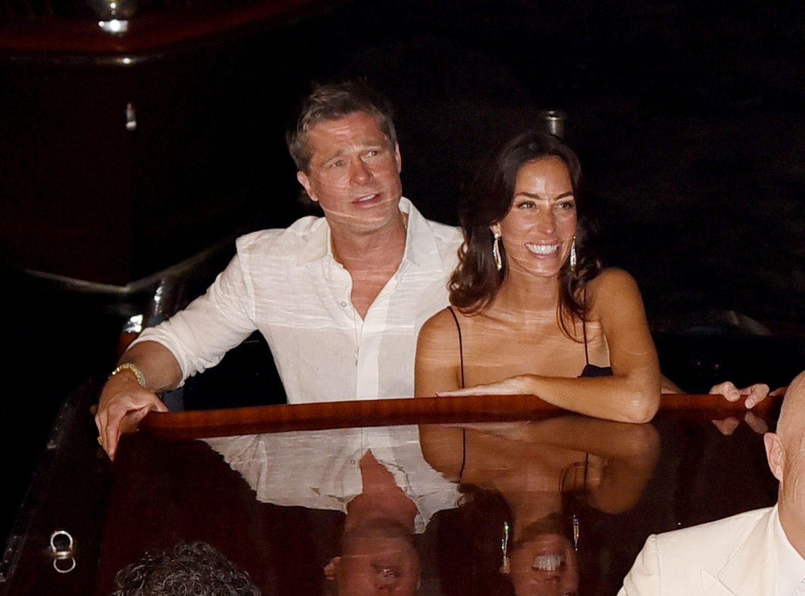 Image may contain Brad Pitt Face Head People Photography Portraits Accessories Jewelry Necklaces Adults and Glasses